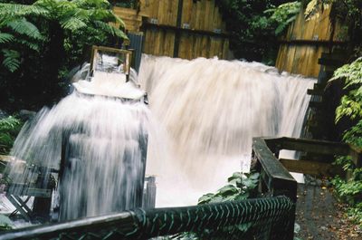 Waterwheel and waterway in flood. 