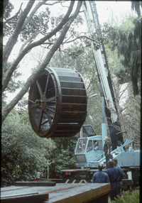 Waterwheel being hoisted out for repair_2. 