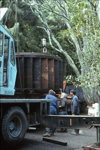 Waterwheel being loaded on truck. 